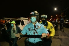 A Philadelphia Police Officer is covered in blood after an altercation during a protest.. (Photo by Lloyd Mitchell)