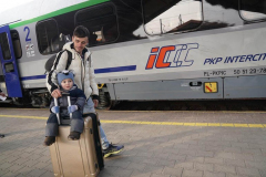 A father wheels his son on a suitcase to a train at Przemysl station, six days after the start of Russia’s attacks on Ukraine, March 1, 2022 in Przemysl, Poland. Przemysl station has become a safe haven for thousands of people fleeing the war that Russia launched against Ukraine on February 24.