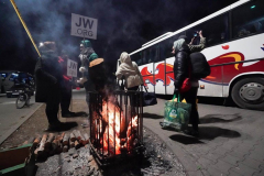 Refugees change buses at a temporary transfer point at an abandoned shopping center in Przemysl after crossing the bkrder from Ukraine on March 2, 2022