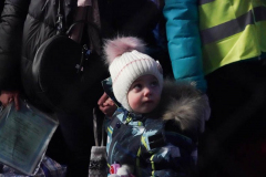 A child waits at customs clearance after making a 32 hour train ride from Kyiv to Przemysl station after crossing the border from Ukraine on March 2, 2022