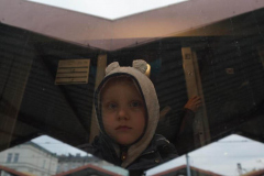 A child looks from the window of train departing for Krakow from Przemysl station after crossing the border from Ukraine on March 2, 2022.