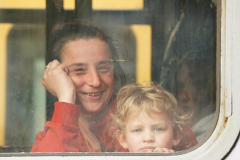 A mother and child that left Ukraine look from a train bound for Krakov from Przemysl station in Poland on March 3, 2022
