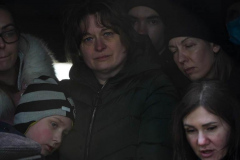 A group of people wait to disembark a train carrying refugees from Ukraine arrives to Przemysl station in Poland on March 3, 2022