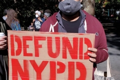 Mass march to defund the New York City Police Department, Tax the rich, and stop the layoffs held at Washington Square Park in New York's Greenwich Village.