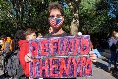 Mass march to defund the New York City Police Department, Tax the rich, and stop the layoffs held at Washington Square Park in New York's Greenwich Village.